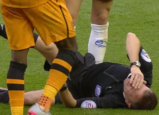 Chuba Akpom injures referee Keith Stroud during Hull City's Championship clash at Sheffield Wednesday
