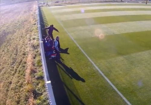 Romanian under-17 coach kicks youth player sitting on the sidelines