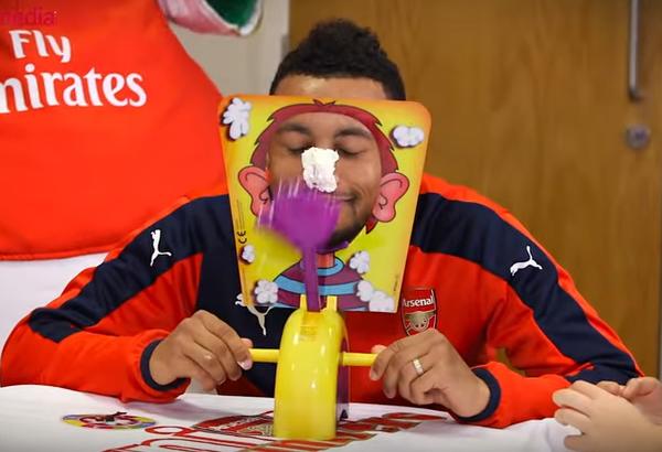 The Arsenal players play Pie Face with young fans in the Junior Gunners supporters group