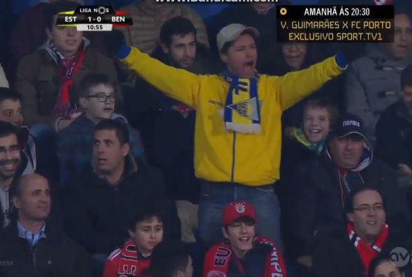 An Estoril fan celebrates their only goal against Benfica on his own