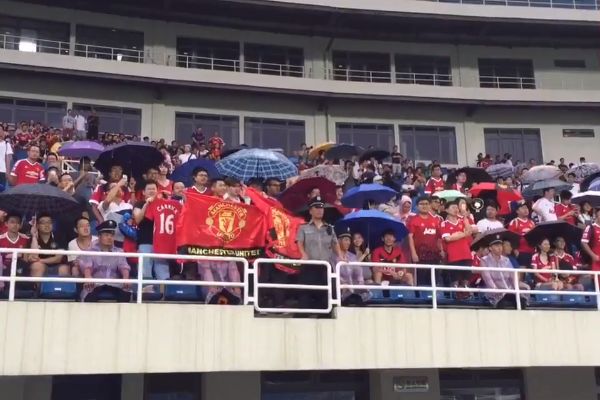 Chinese Manchester United fans sing 'F*** off City' at the Bird's Nest stadium in Beijing ahead of a friendly against Man City