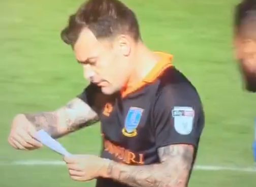 Sheffield Wednesday's Ross Wallace steals a Huddersfield tactics note