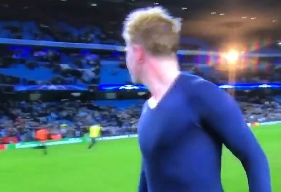 A fan is chased by a steward after getting Kevin De Bruyne's shirt