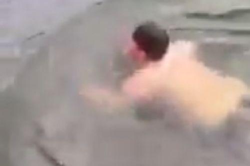 England fan dives into canal in Dortmund and swims in it while in Germany for friendly