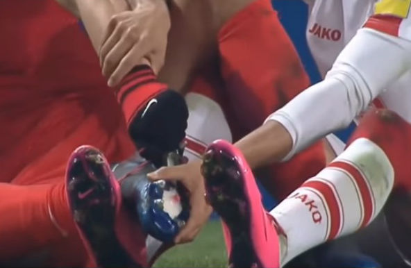 A player's studs get caught on an opponent's laces during South Korea 1-0 Syria