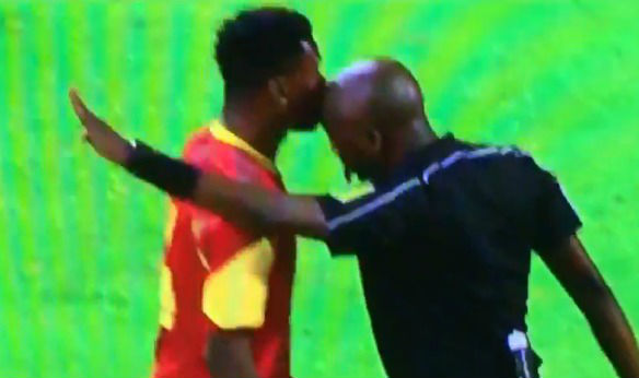 The referee headbutts a player during South Africa v Angola