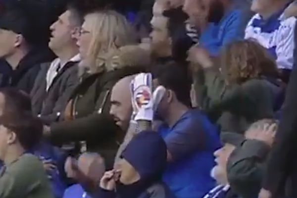 A Reading fan wearing goalie gloves in the crowd for game against Norwich