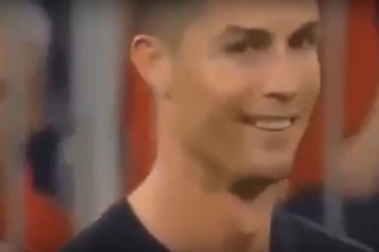Cristiano Ronaldo smiles at a pitch invader after Bayern vs Real Champions League semi-final