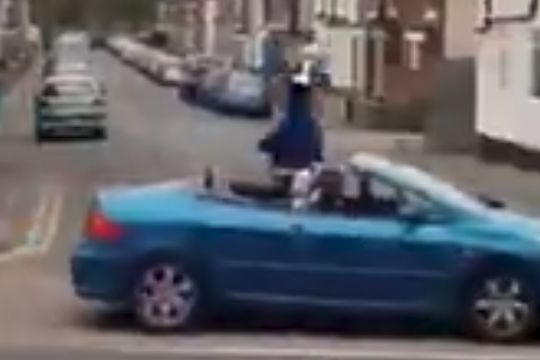 Amateur team Nags Head & Plough FC parade trophy in an open-top car