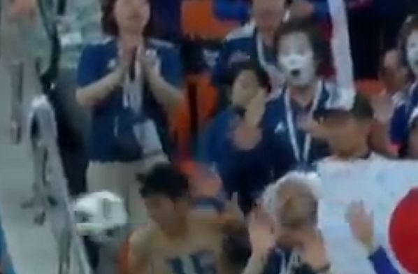 Japan fan heads ball back from stands during Senegal draw