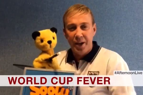 Sooty offers his support to England on BBC News before the World Cup semi-final defeat to Croatia at Russia 2018