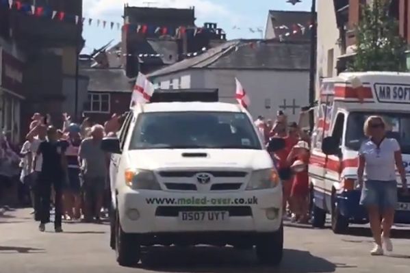 Fans follow car playing "Vindaloo" and sing along to celebrate England reaching World Cup semi-finals