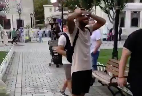 Barcelona's Rafinha kicks a group of children's ball into a tree when trying to pass it back to them