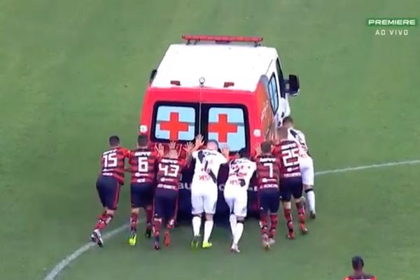 An ambulance carrying Vasco da Gama’s Bruno Silva is push started by players