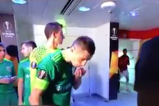 Vorskla Poltava captain Volodymyr Chesnakov washes his face with his own spit in the tunnel at Arsenal before a Europa League clash