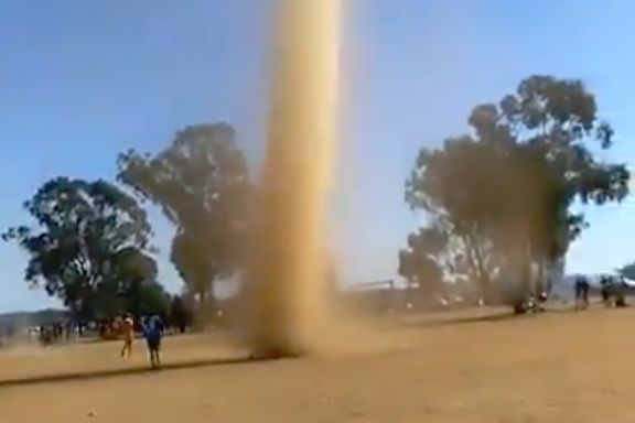 A tornado-like dust devil interrupts an amateur match in South Africa