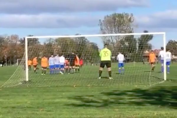A father videoing his son playing in goal was prevented by a van