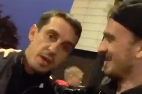 Gary Neville hurries a selfie a Russian reporter tries to take of them both