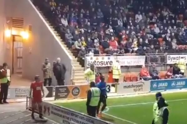 Leyton Orient fan mimics substitutes' warm-up exercises during 3-1 win over Bromley