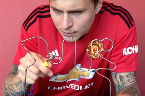 Victor Lindelöf plays a buzz wire game for Manchester United's Instagram account