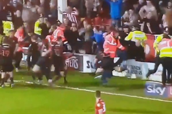 Luke O'Nien jumps on a Sunderland fan after Lynden Gooch's late leveller in the 2-2 draw at Walsall