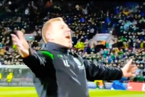Hibernian manager Neil Lennon prematurely celebrates a disallowed goal at Hearts before being hit by coin thrown from the stands