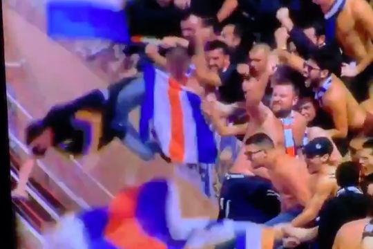 A Montpellier fan falls out of the stand when celebrating a goal in a 2-1 win at Monaco