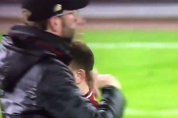 Xherdan Shaqiri disappears inside Jürgen Klopp's coat following Wolves 2-1 Liverpool in the FA Cup
