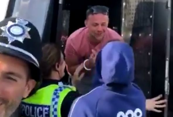 Birmingham City's Che Adams visits a pitch invader in the back of a police van after 1-3 win at Rotherham United