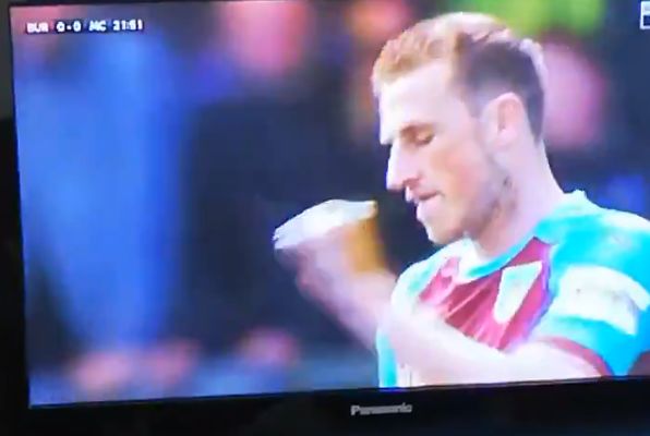 Chris Wood catches an insect during Burnley vs Manchester City at Turf Moor
