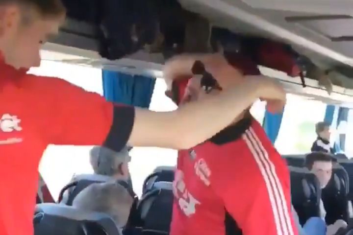 Guingamp supporter falls down the stairs on a coach while leading chant on the way to Coupe de la Ligue final