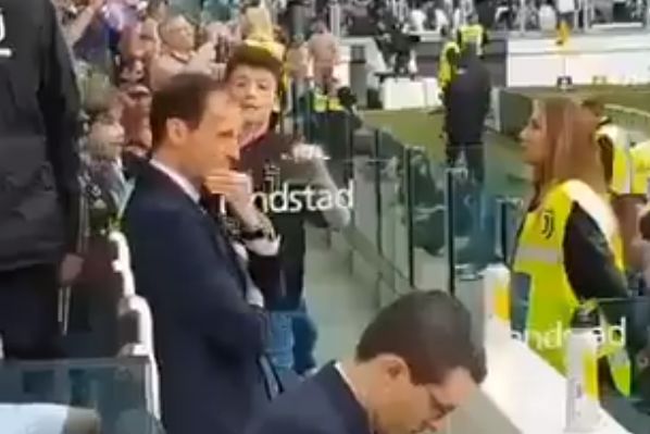Juventus manager Massimiliano Allegri refuses to give a child an autograph during a match