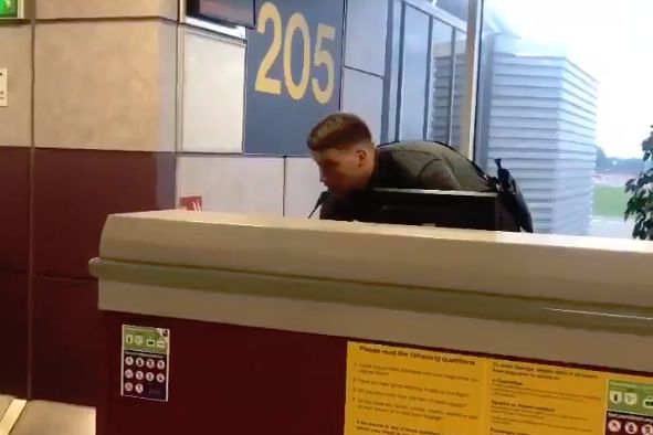 Liverpool fan says Roberto Firmino chant into microphone at airport departure gate before Champions League final