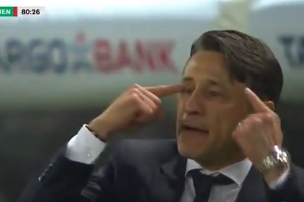 Bayern Munich manager Niko Kovač pokes himself in the eye during the 3-0 DFB-Pokal final win over Leipzig