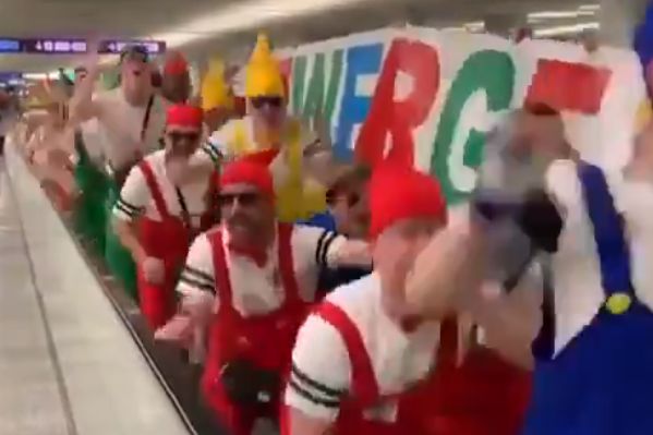 VfB 03 Hilden players and staff dress as characters from Snow White and the Seven Dwarfs and sing Yaya/Kolo chant at airport on way to Mallorca