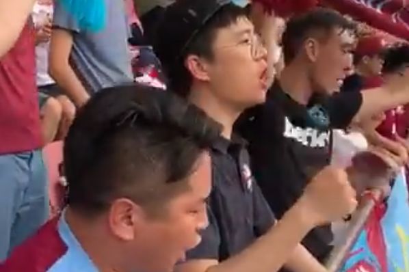 Chinese West Ham fans sing "I'm Forever Blowing Bubbles" during friendly against Newcastle in Shanghai