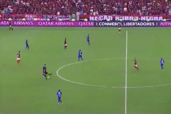 Referee Néstor Pitana tries to kick a ball out of play but misses it in Copa Libertadores round of 16 second leg between Flamengo and Emelec