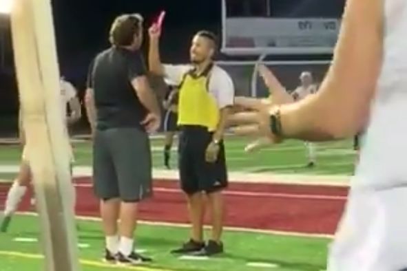 Referee shows Fairmont State University coach a pink card in gender reveal during match