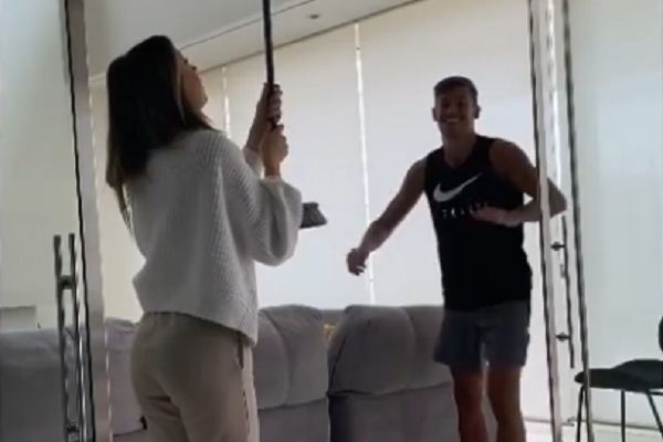 Atlético Madrid's Marcos Llorente tricks girlfriend into holding a drink up to the ceiling with a broomstick