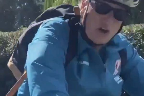 Passenger in car says hello to Middlesbrough manager Neil Warnock while he's cycling