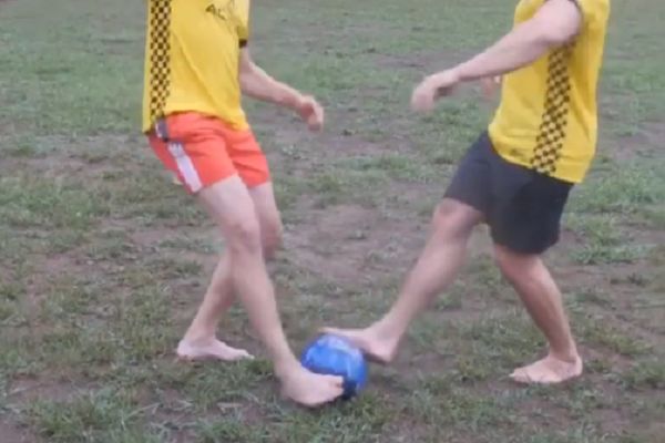 Barefoot football with bowling ball