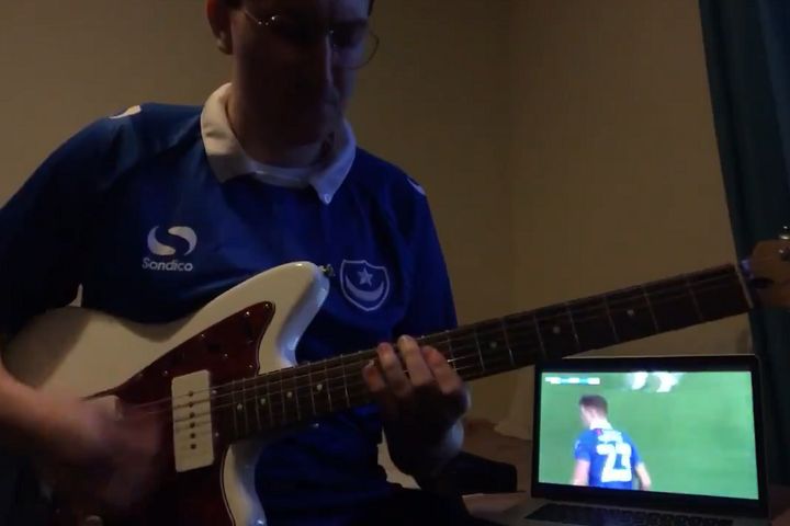 Portsmouth fan plays guitar over music left on by BBC Sport during FA Cup game against King's Lynn Town