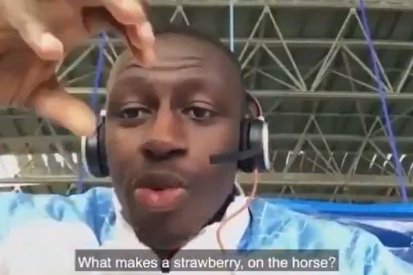 Benjamin Mendy asks "what makes a strawberry on the horse" to two young Manchester City supporters
