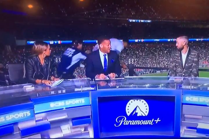 Fan runs away from security and jumps over barrier behind CBC Sports presenters covering CONCACAF Nations League final between USA and Mexico