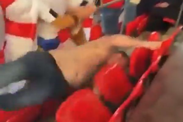 England falls over seats while dancing in the stands at Wembley for semi-final against Denmark